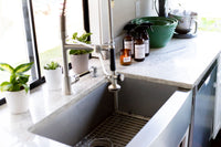 Kitchen sink with Vida Verde Home candles and sprays
